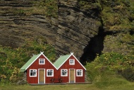 Red holiday homes in front of...