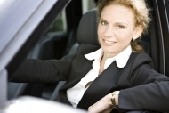 Woman at the steering wheel o...