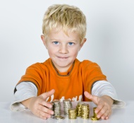 Boy, 5-years old, stacks of m...