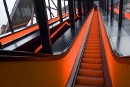 Illuminated escalator leading...