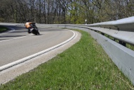 Motorcyclist in a curve on a ...