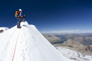 Mountaineer on the summit rid...