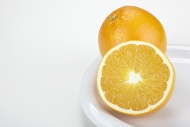 Two oranges (Citrus sinensis)...