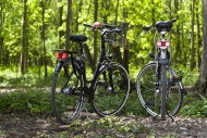 Two bicycles standing in the ...