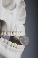 Skeleton with a euro-coin bet...