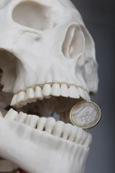 Skeleton with a euro-coin bet...