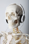 Skeleton wearing headphones