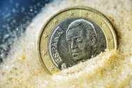 Spanish one-euro coin sinking...