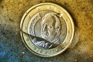 Spanish one-euro coin sinking...