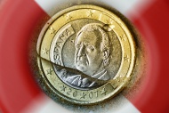 Spanish one-euro coin sinking...