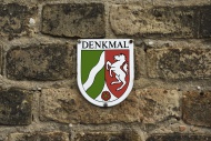 Sign with the coat of arms of...