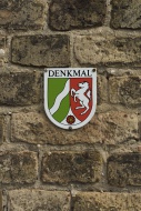 Sign with the coat of arms of...