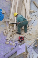 Construction worker cutting b...