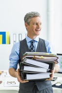 Germany, Businessman holding ...