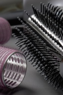 Hairbrush and curlers, close-up