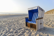 Roofed wicker beach chair on ...