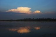 Cloudy atmosphere, lake, refl...
