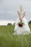 Rear view of a bride holding ...