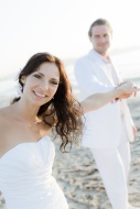 Bride and groom on the beach,...