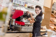 Waitress making coffee, Austria