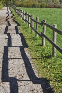 Fence with a shadow along the...