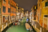 Canal with boats and colourfu...