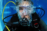 Scuba diver with air bubbles,...