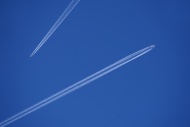 Two airplanes with contrails ...