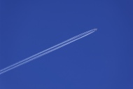 Airplane with contrails in th...