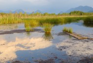 Reflecting clouds of a fading...