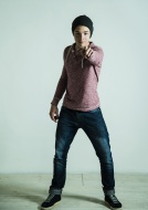 Portrait of teenager pointing...