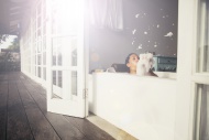 Woman in bathtub blowing foam