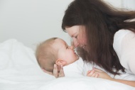 Mother cuddling baby girl