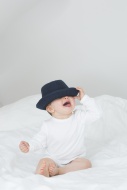 Baby girl with oversized hat