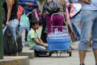 Peru, Lima, boy selling water...
