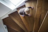 Baby girl climbing up a stair