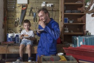 Father and son working in hom...