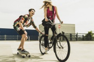 Happy young couple with bicyc...