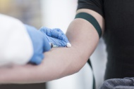 Doctor taking blood sample