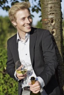 Smiling young man outdoors wi...