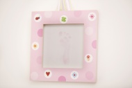 Pink picture frame with footp...