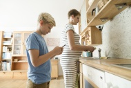 Pregnant woman and son with s...