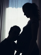 Pregnant woman and man in fro...