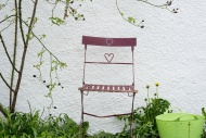 Garden chair in front of a wall