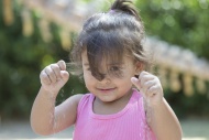 Portrait of little girl playi...