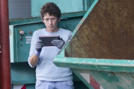 Woman at a waste container lo...