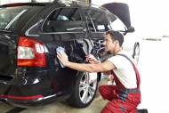 Car cleaning, man polishing car
