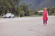 Little girl hitchhiking