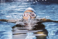 Female triathlet with goggles...