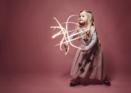 Little girl lightpainting wit...